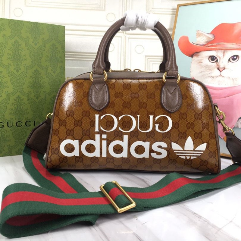 G*u*i top handle bags